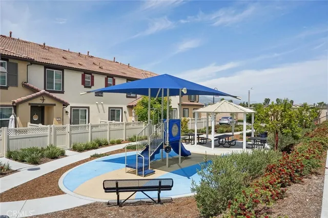 a table and chairs in front of a house