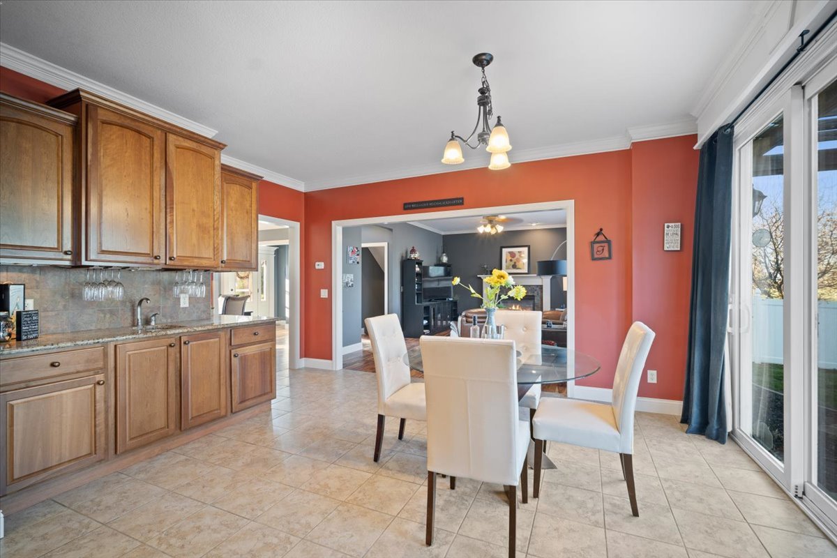 1706 Pfitzer Road Normal, IL 61761 - Photo 14 of 27 a view of a dining room with furniture window and outside view