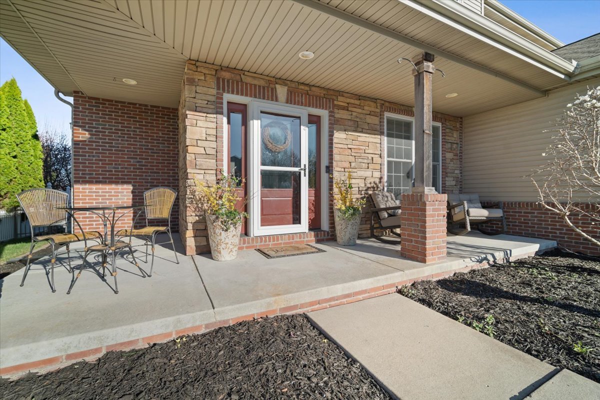1706 Pfitzer Road Normal, IL 61761 - Photo 2 of 27 a building outdoor space with patio furniture and potted plants