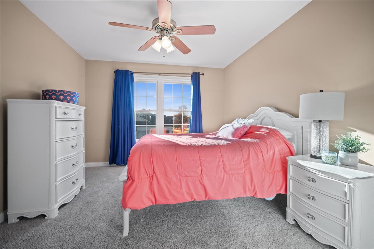 1706 Pfitzer Road Normal, IL 61761 - Photo 21 of 27 a bedroom with a bed and a dresser