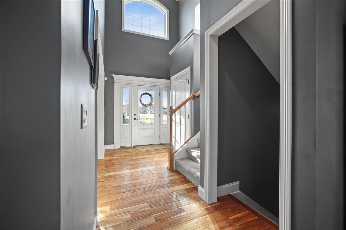 1706 Pfitzer Road Normal, IL 61761 - Photo 4 of 27 a view of a hallway with wooden floor and entryway