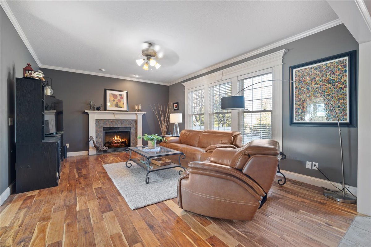 1706 Pfitzer Road Normal, IL 61761 - Photo 5 of 27 a living room with furniture and a fireplace