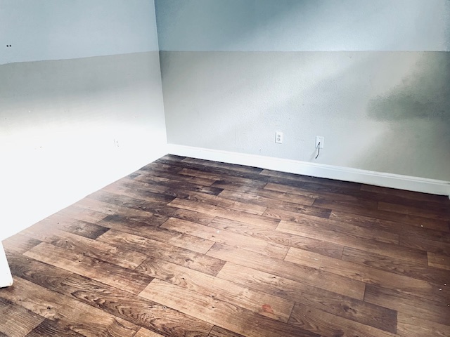 107 East Wheeler Street Manor, TX 78653 - Photo 7 of 7 a view of a room with wooden floor