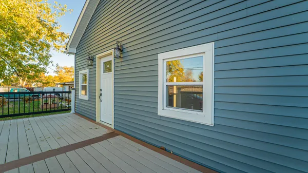 a view of a balcony with wooden floor