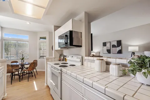 a kitchen with a stove and a microwave