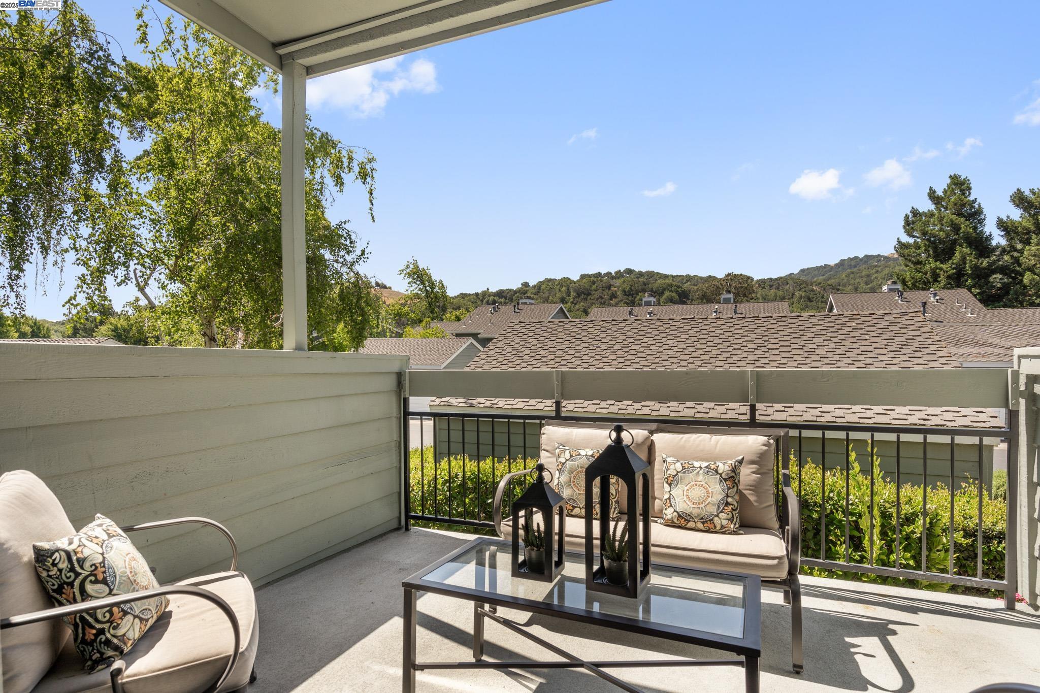 8165 Mountain View Drive, Unit C Pleasanton, CA 94588 - Photo 16 of 35 a view of a chairs and table in patio