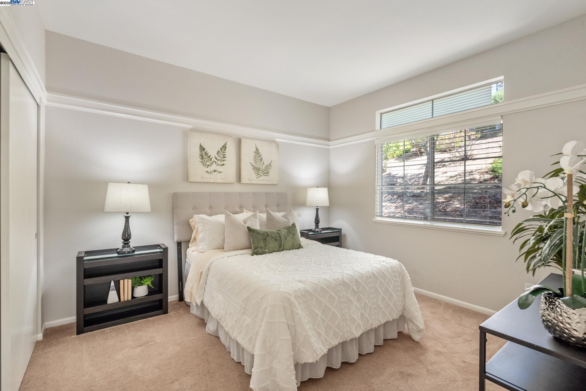 8165 Mountain View Drive, Unit C Pleasanton, CA 94588 - Photo 18 of 35 a bedroom with a bed and a window