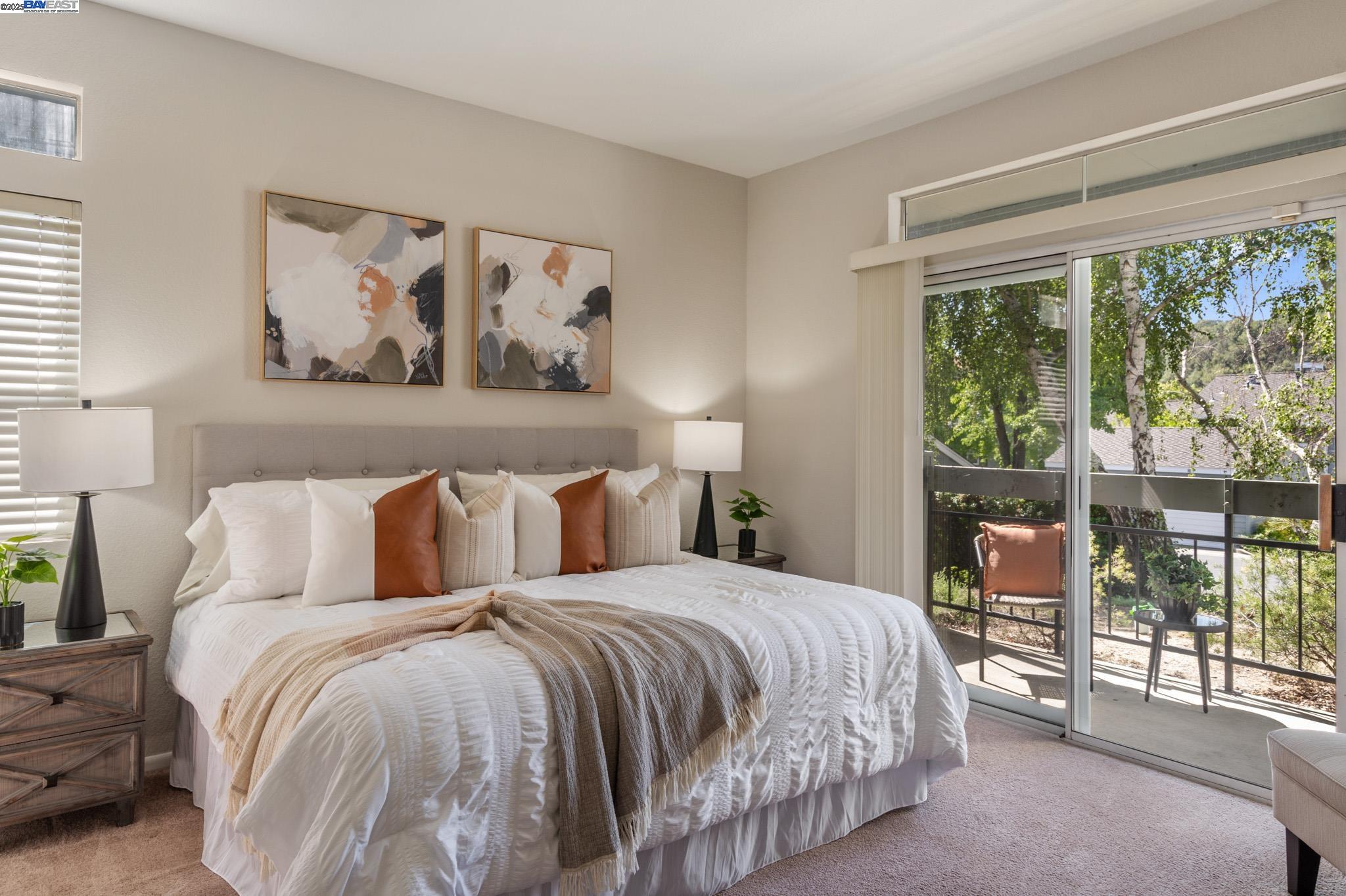 8165 Mountain View Drive, Unit C Pleasanton, CA 94588 - Photo 20 of 35 a bedroom with a large bed and a large window