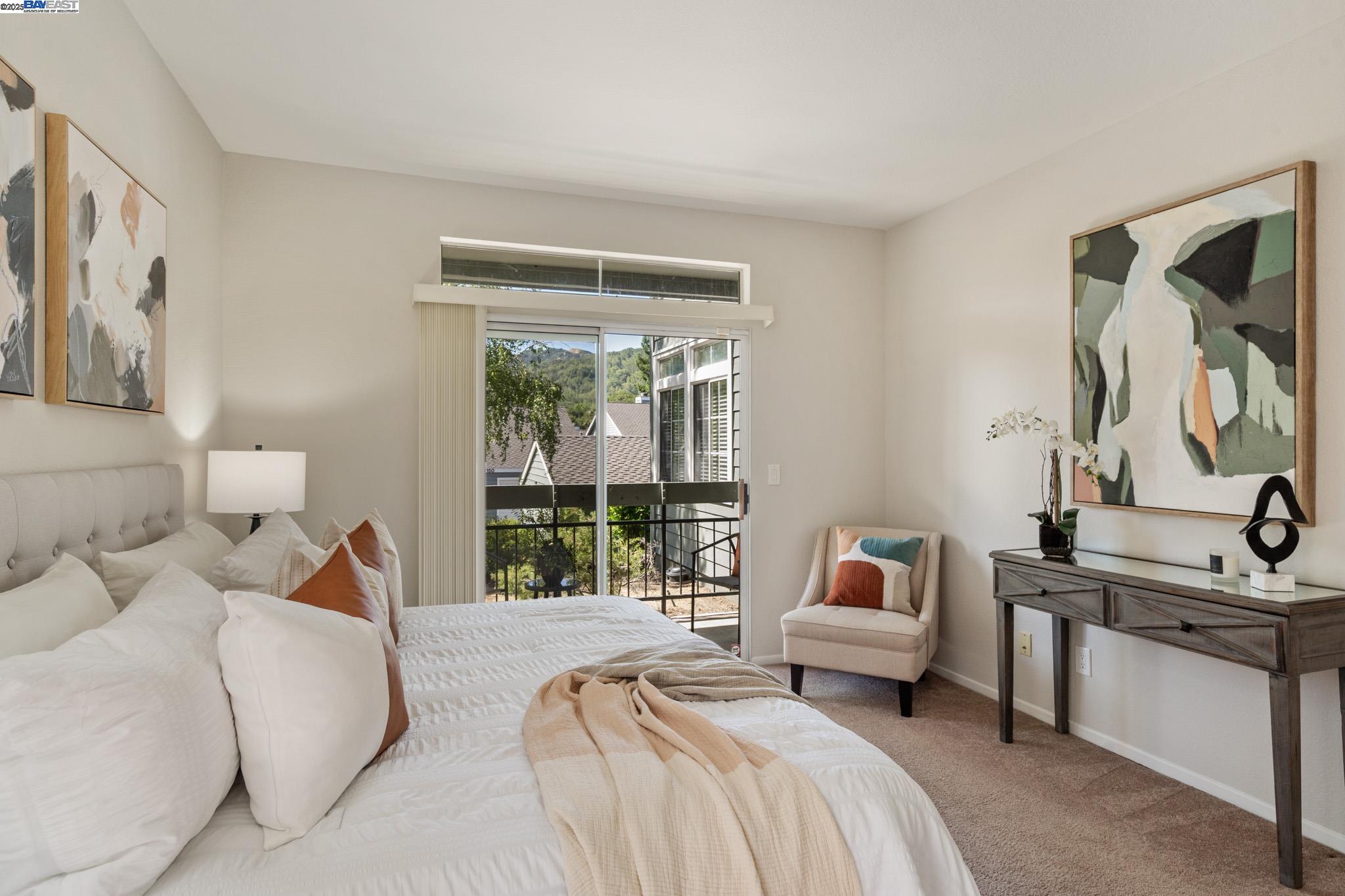 8165 Mountain View Drive, Unit C Pleasanton, CA 94588 - Photo 21 of 35 a bedroom with a large bed and a window