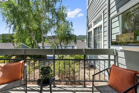 a view of a livingroom with furniture and staircase