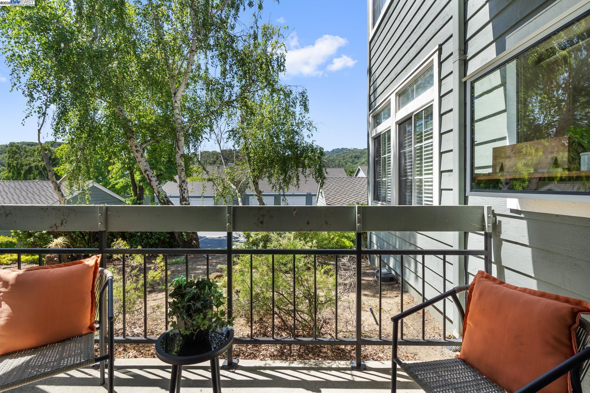 8165 Mountain View Drive, Unit C Pleasanton, CA 94588 - Photo 22 of 35 a view of a balcony with wooden floor and outdoor seating