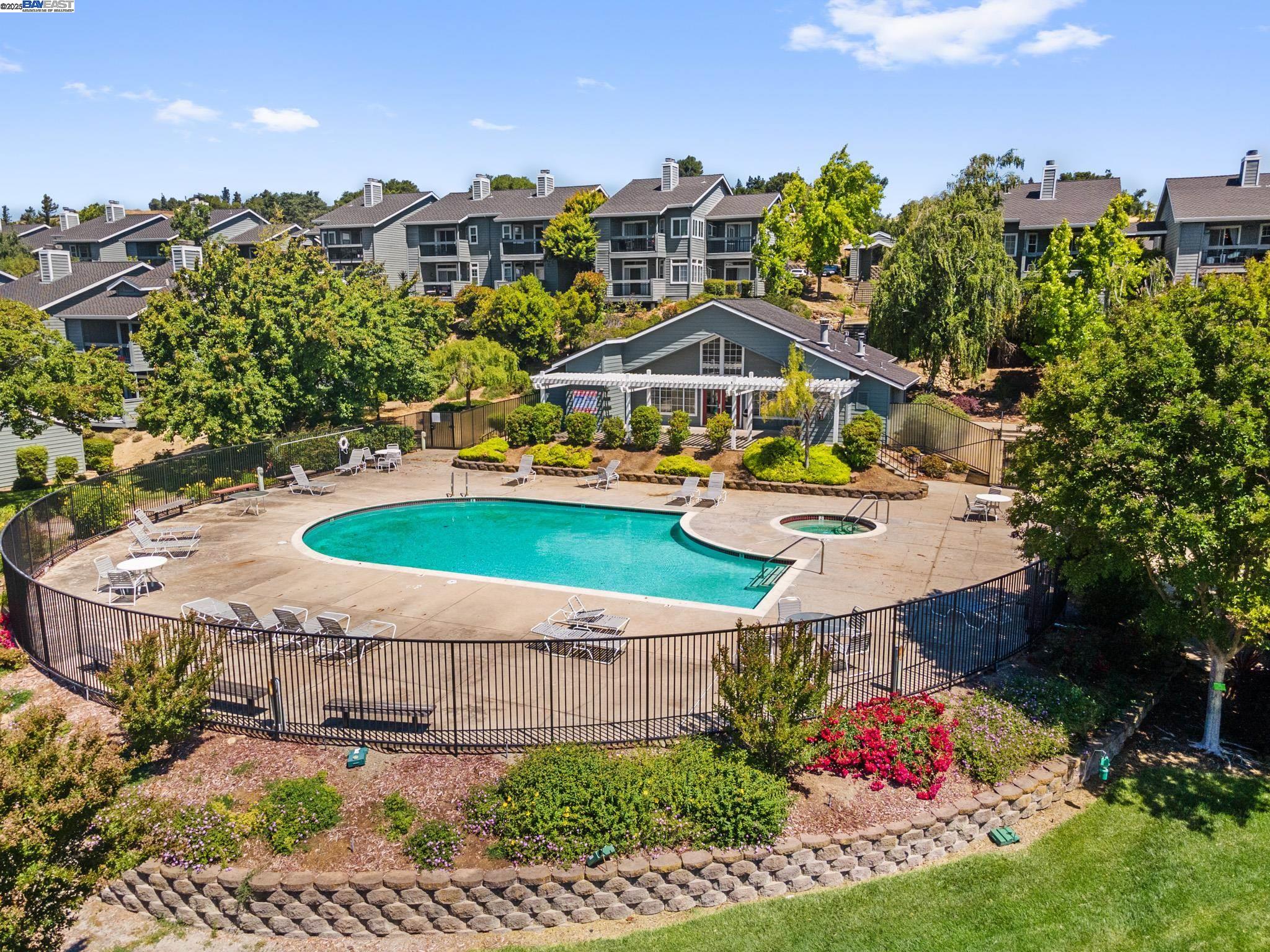 8165 Mountain View Drive, Unit C Pleasanton, CA 94588 - Photo 33 of 35 a view of a house with a yard and potted plants