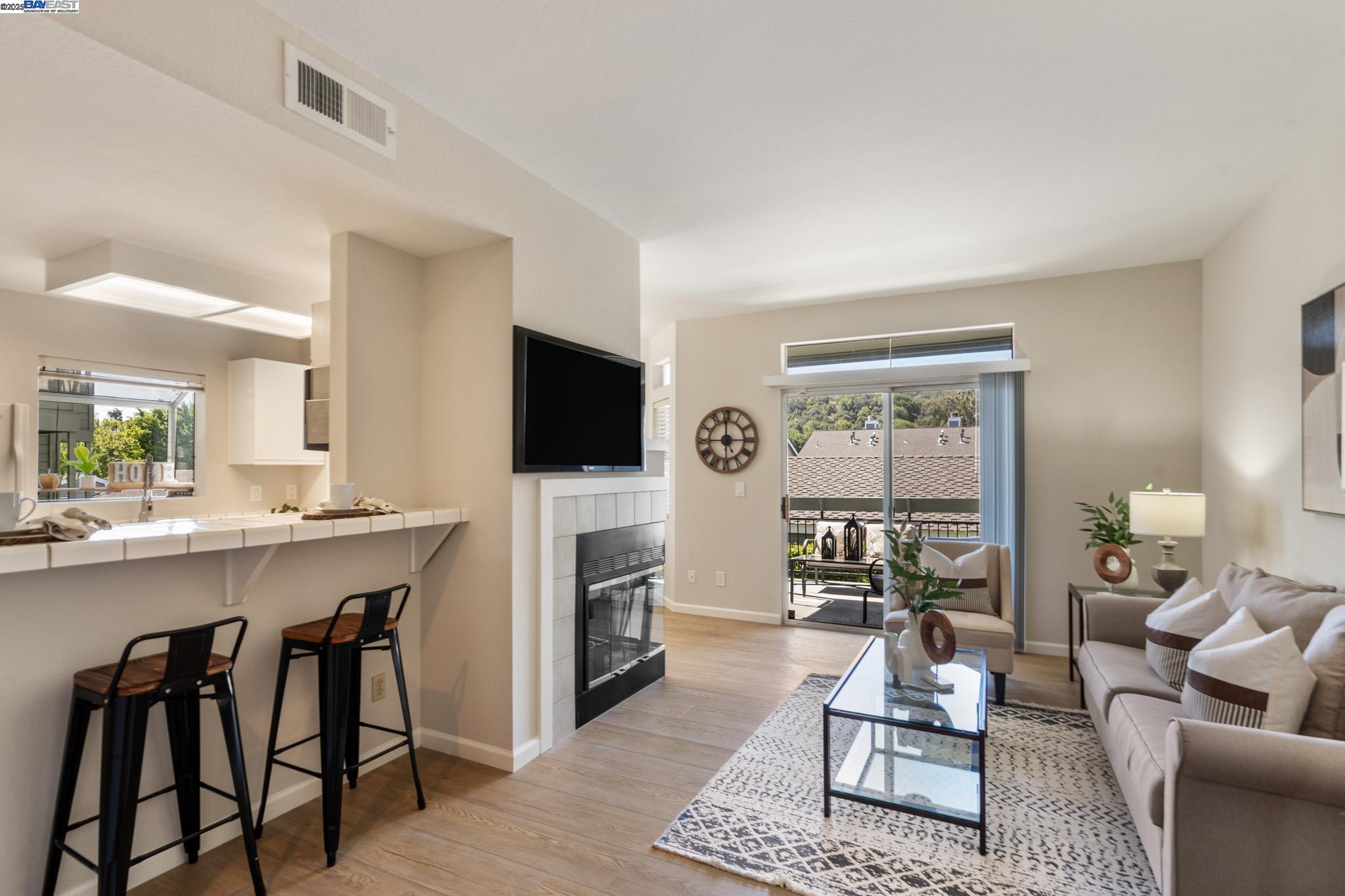 8165 Mountain View Drive, Unit C Pleasanton, CA 94588 - Photo 4 of 35 a living room with furniture and a flat screen tv
