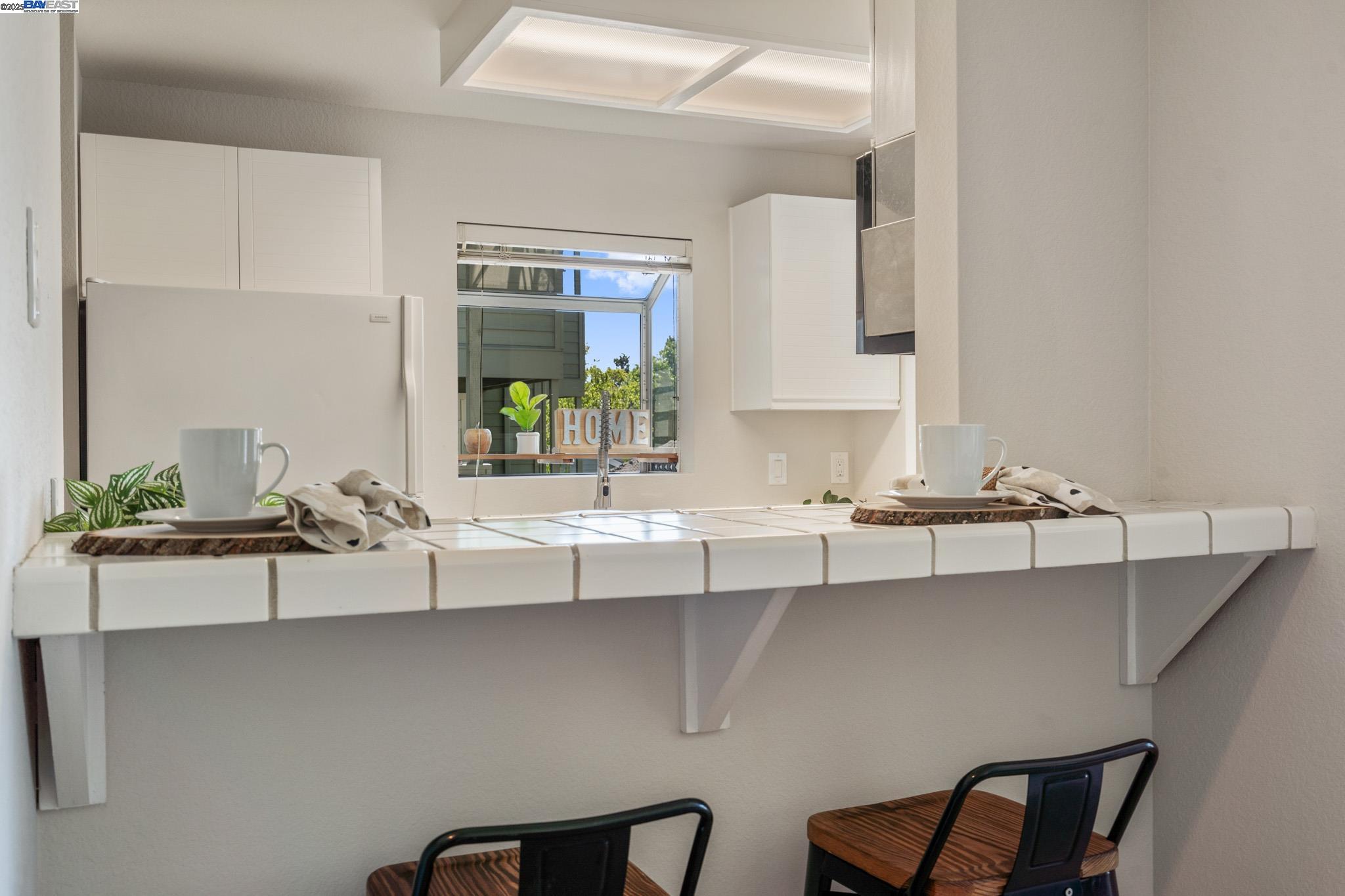 8165 Mountain View Drive, Unit C Pleasanton, CA 94588 - Photo 9 of 35 a bathroom with a sink and a mirror