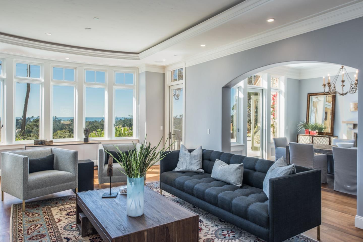 1451 Riata Road Pebble Beach, CA 93953 - Photo 3 of 18 a living room with furniture and large windows