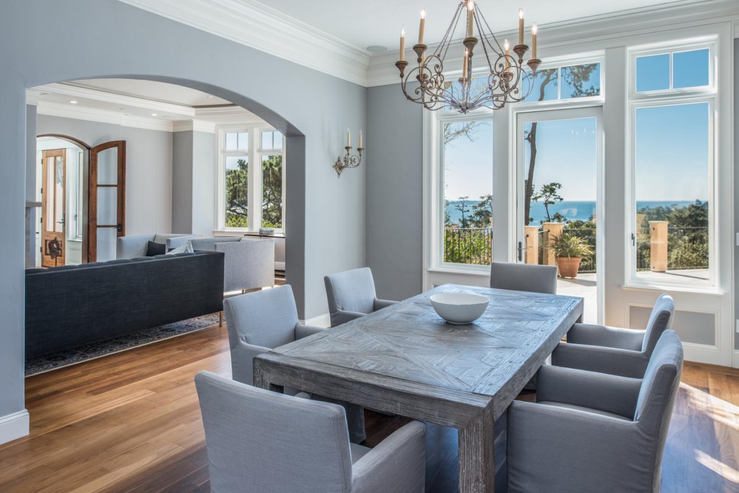 1451 Riata Road Pebble Beach, CA 93953 - Photo 5 of 18 a view of a dining room with furniture wooden floor and chandelier