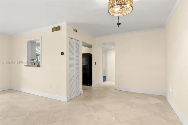 a view of a room with cabinet and mirror