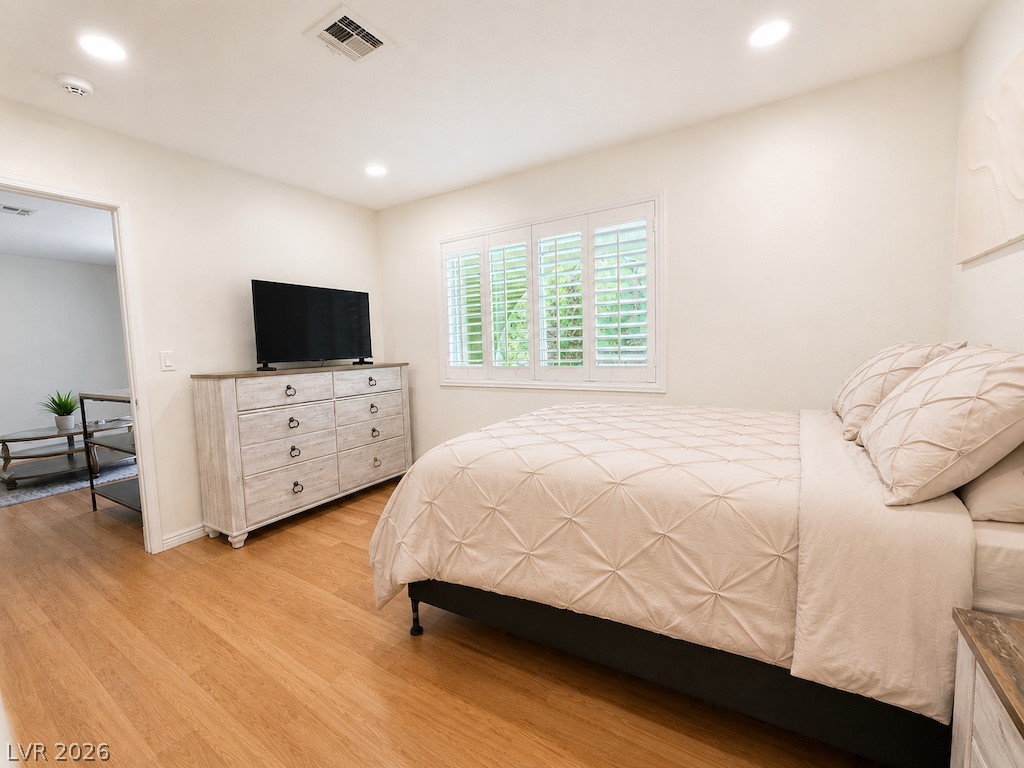 3010 East Viking Road Las Vegas, NV 89121 - Photo 35 of 48 Hardwood floors and a well-lit window create a restful bedroom retreat.