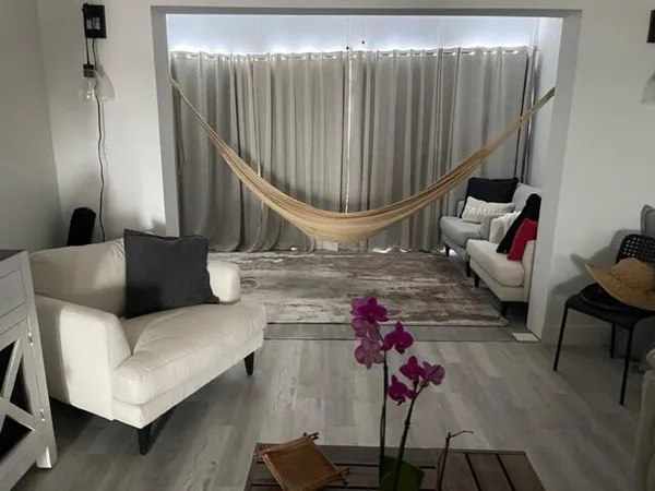 a living room with furniture and a window