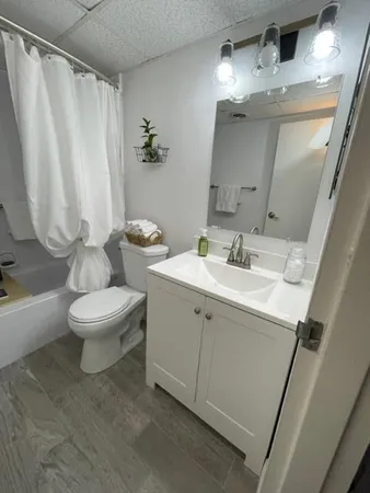 a bathroom with a sink and mirror
