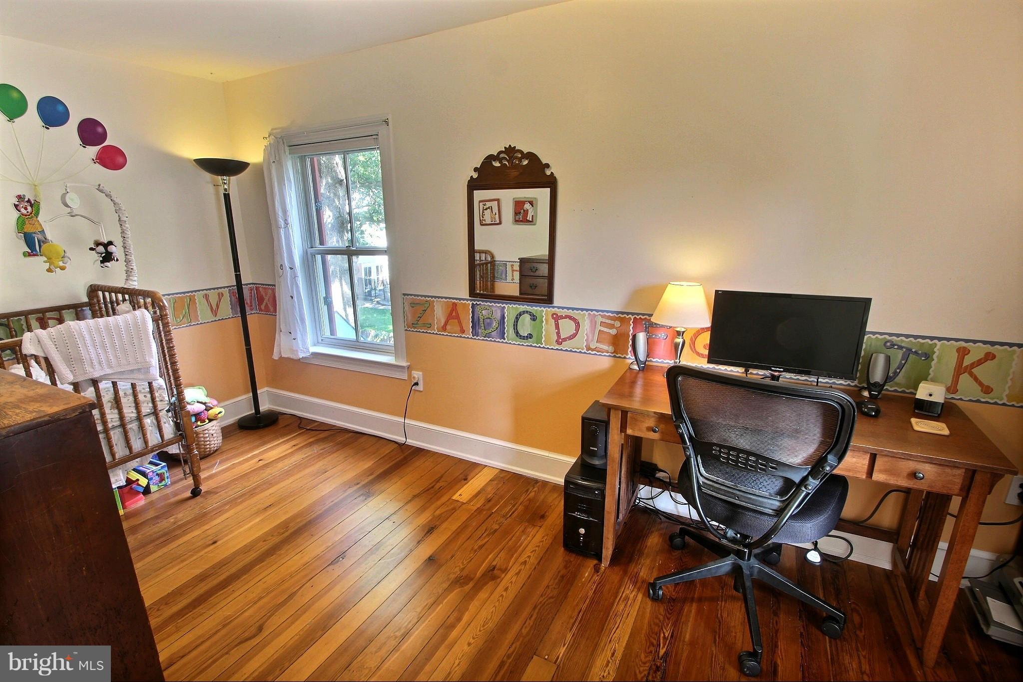 21404 Laytonsville Road Gaithersburg, MD 20882 - Photo 14 of 30 a view of a livingroom with furniture and a flat screen tv