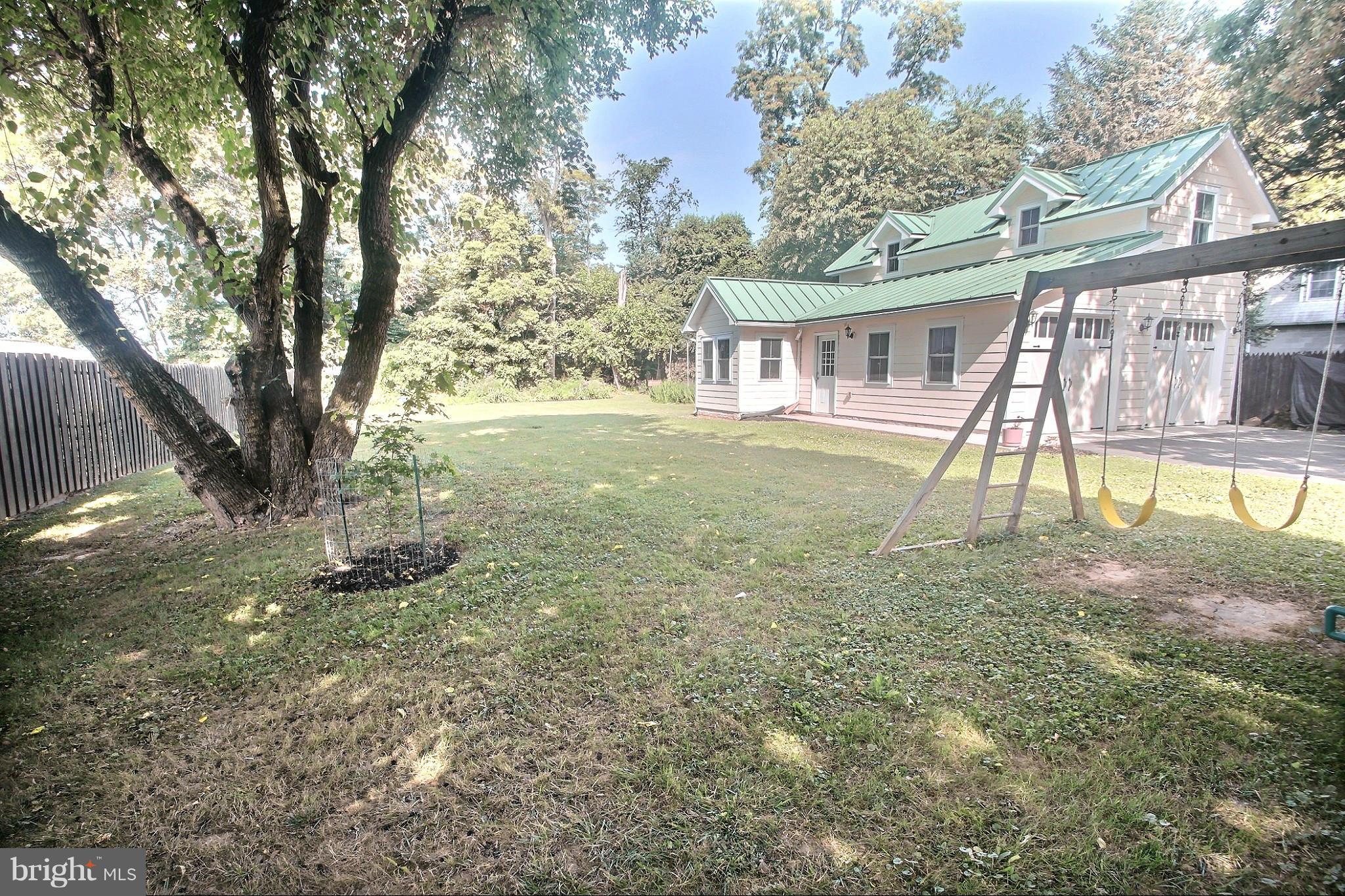 21404 Laytonsville Road Gaithersburg, MD 20882 - Photo 22 of 30 a view of a house with a yard