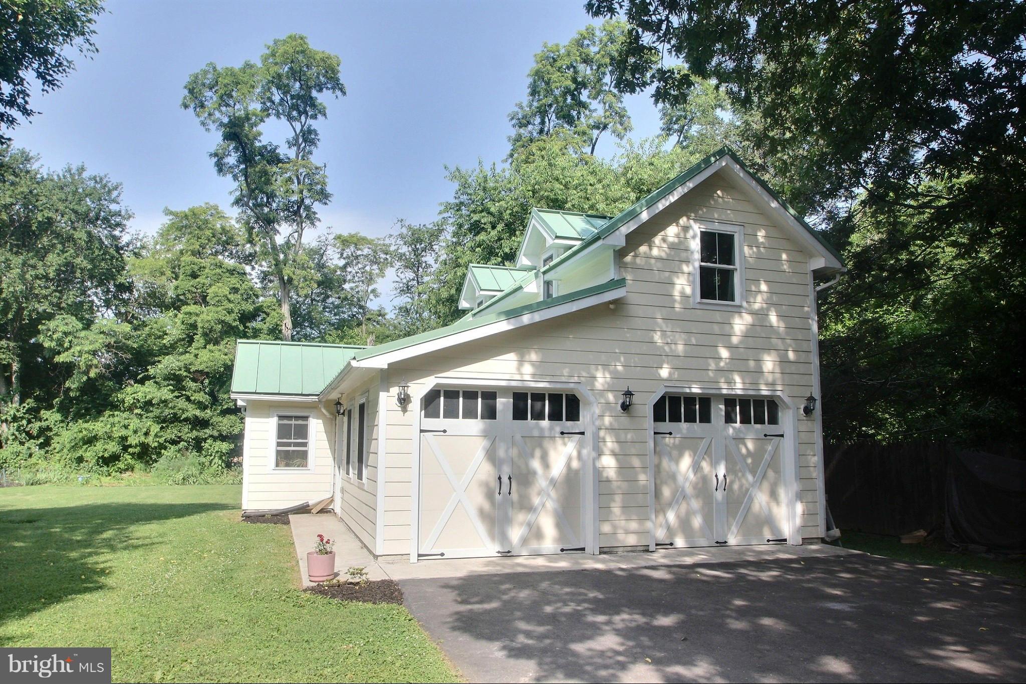 21404 Laytonsville Road Gaithersburg, MD 20882 - Photo 24 of 30 a front view of a house with a yard