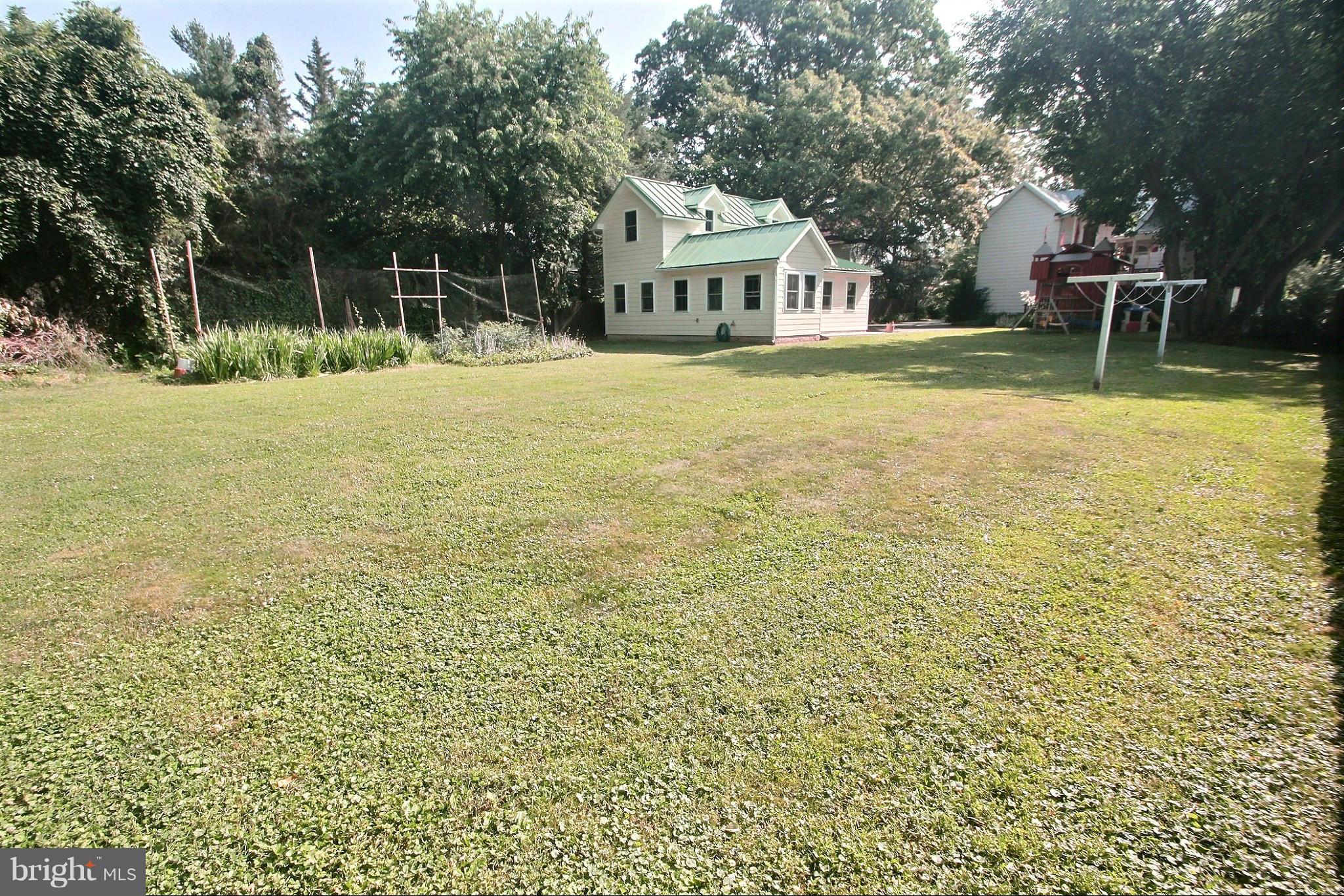 21404 Laytonsville Road Gaithersburg, MD 20882 - Photo 26 of 30 a view of a house with a yard and sitting area