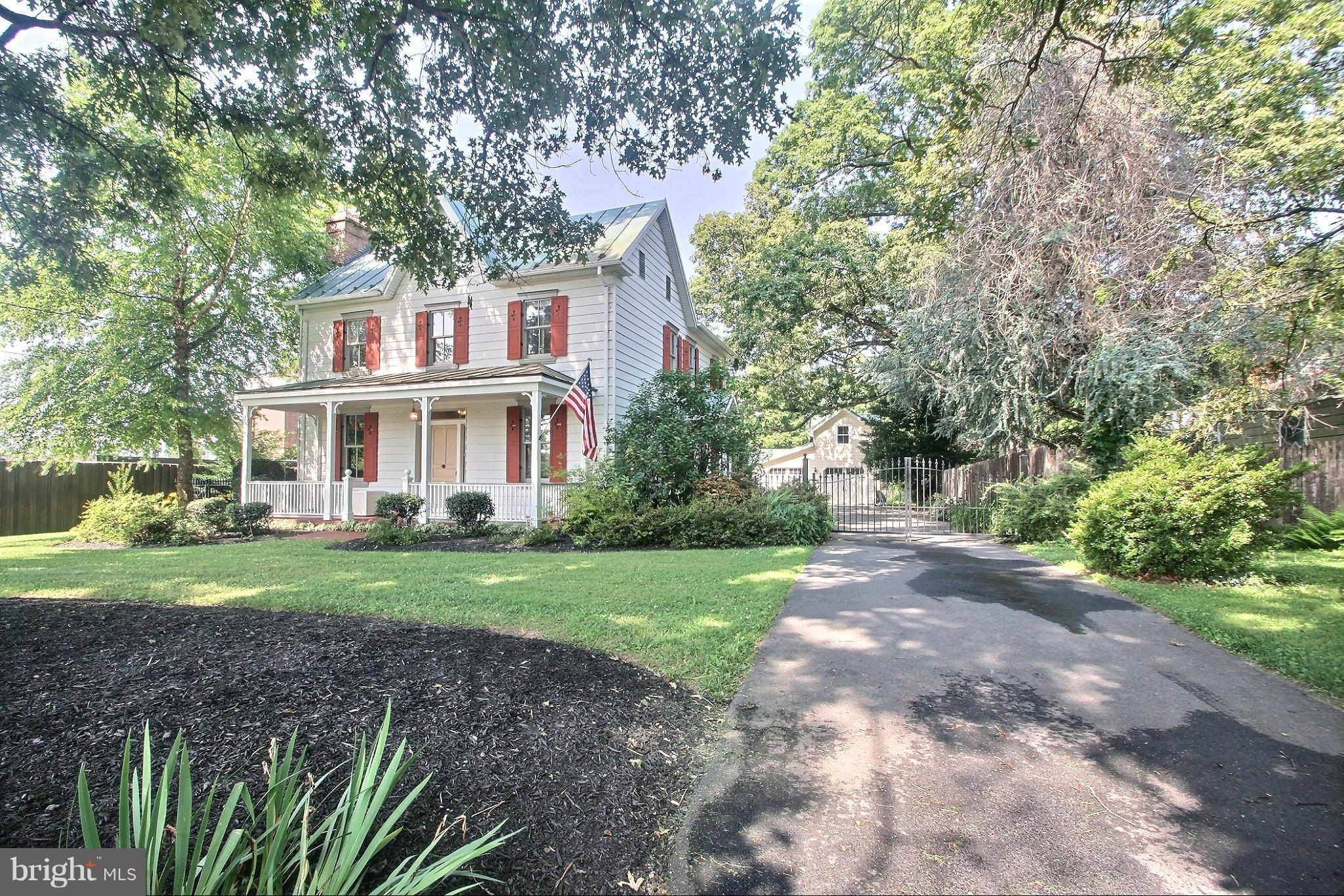 21404 Laytonsville Road Gaithersburg, MD 20882 - Photo 29 of 30 a front view of a house with a yard