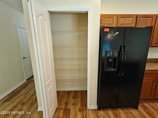 a bathroom with a shower and a mirror