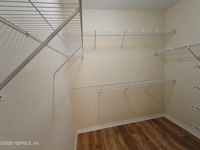 a view of a room with racks on the wall