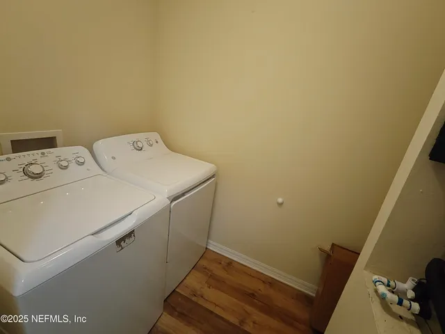 a utility room with dryer and washer
