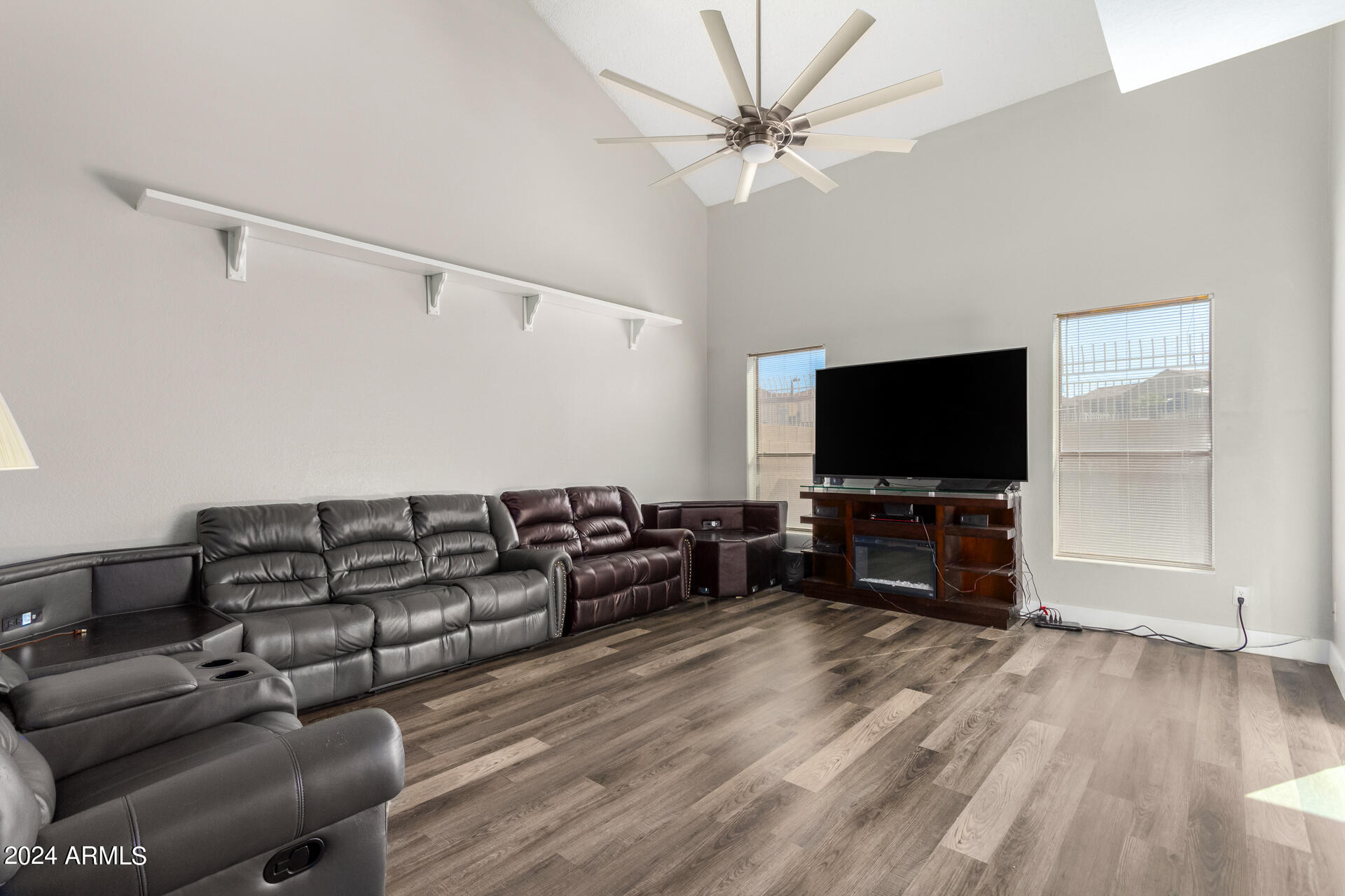 4267 East Agave Road Phoenix, AZ 85044 - Photo 3 of 11 a living room with furniture and a flat screen tv