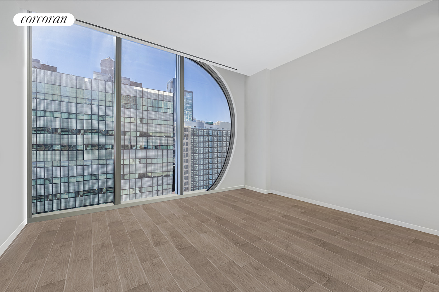 520 West 28th Street, Unit 29 Manhattan, NY 10001 - Photo 7 of 14 a view of an empty room and wooden floor