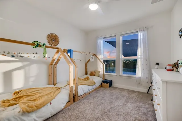 a bedroom with furniture and window