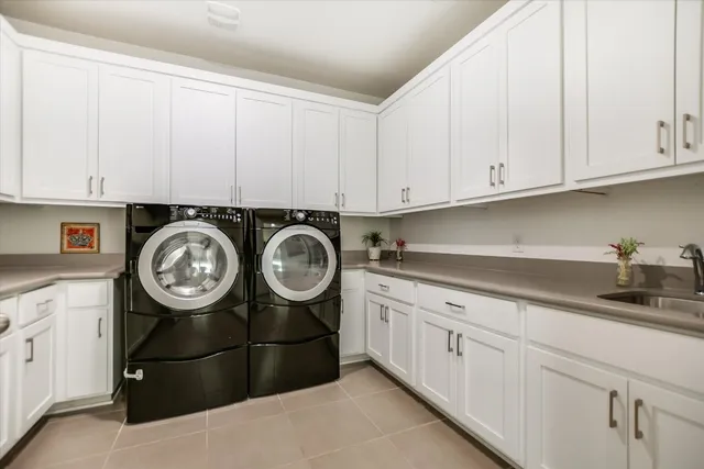 a kitchen with cabinets and a stove top oven