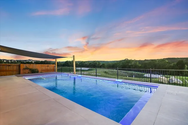 a view of an outdoor space and swimming pool