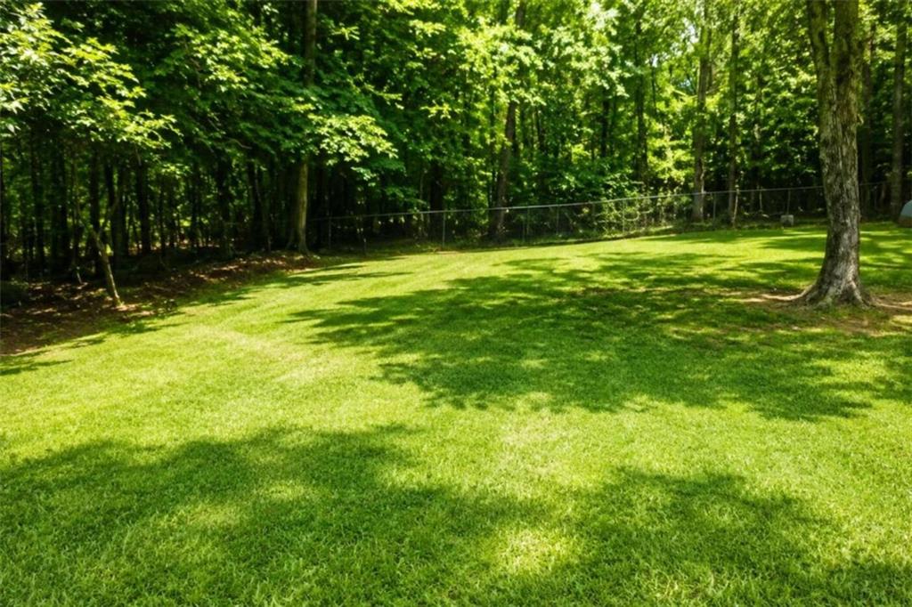 365 River Ridge Trail Oxford, GA 30054 - Photo 32 of 37 a view of outdoor space with deck and yard