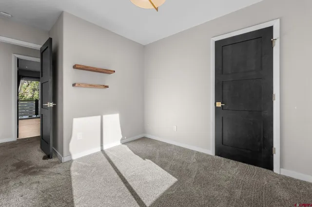 a bathroom with a toilet and shower