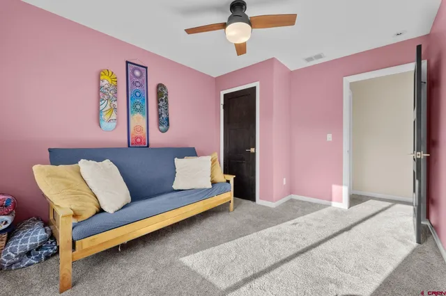 an aerial view of residential house with outdoor space and trees all around