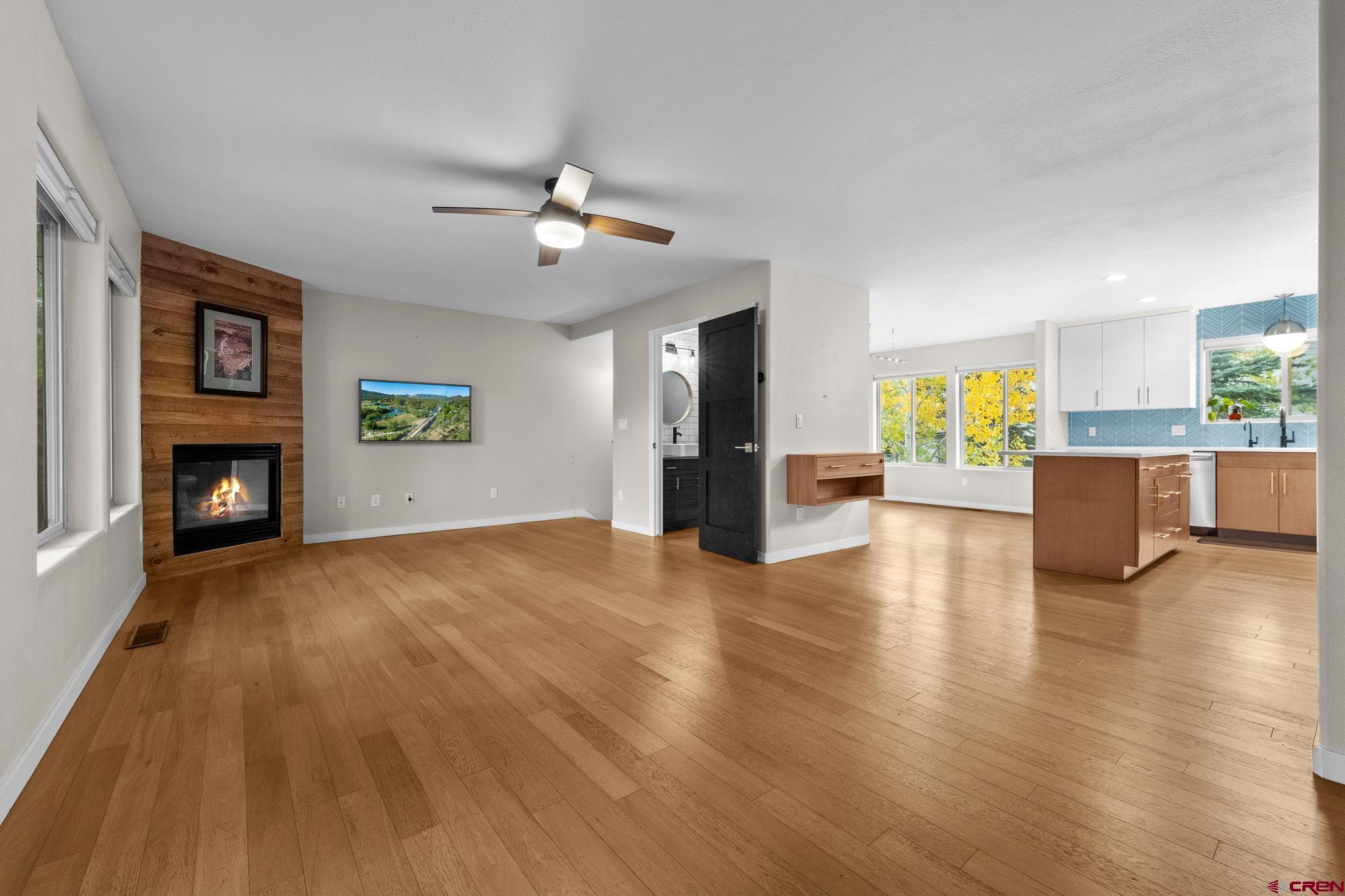 601 Animas View Drive, Unit 204 Durango, CO 81301 - Photo 6 of 32 a view of a livingroom with a fireplace a microwave and furniture