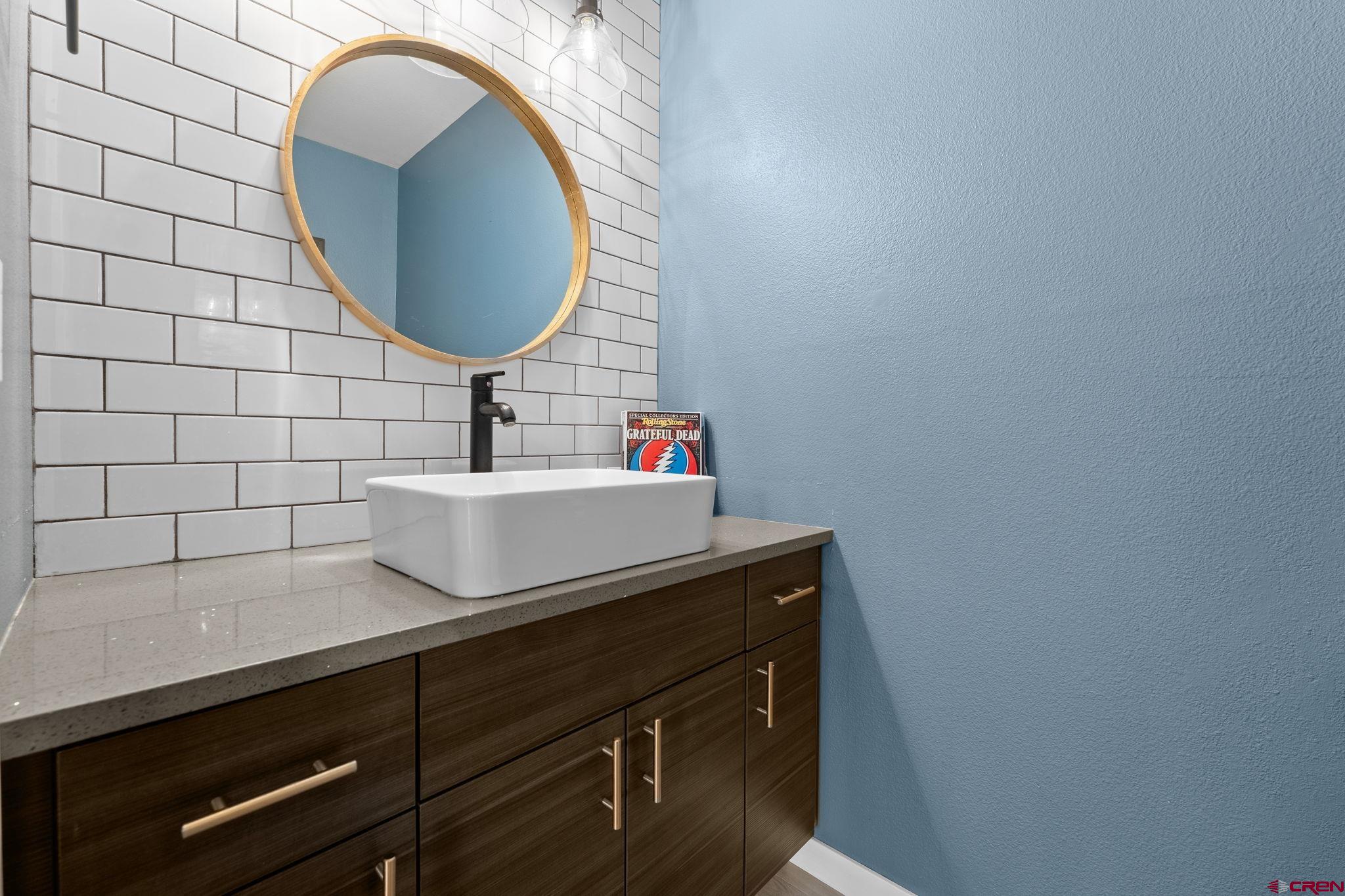 601 Animas View Drive, Unit 204 Durango, CO 81301 - Photo 7 of 32 a bathroom with a sink and a mirror