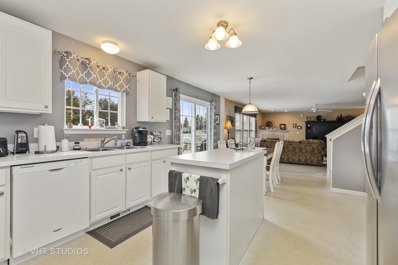 2621 Arbor Drive McHenry, IL 60050 - Photo 12 of 36 a view of living room with granite countertop furniture a window and appliances