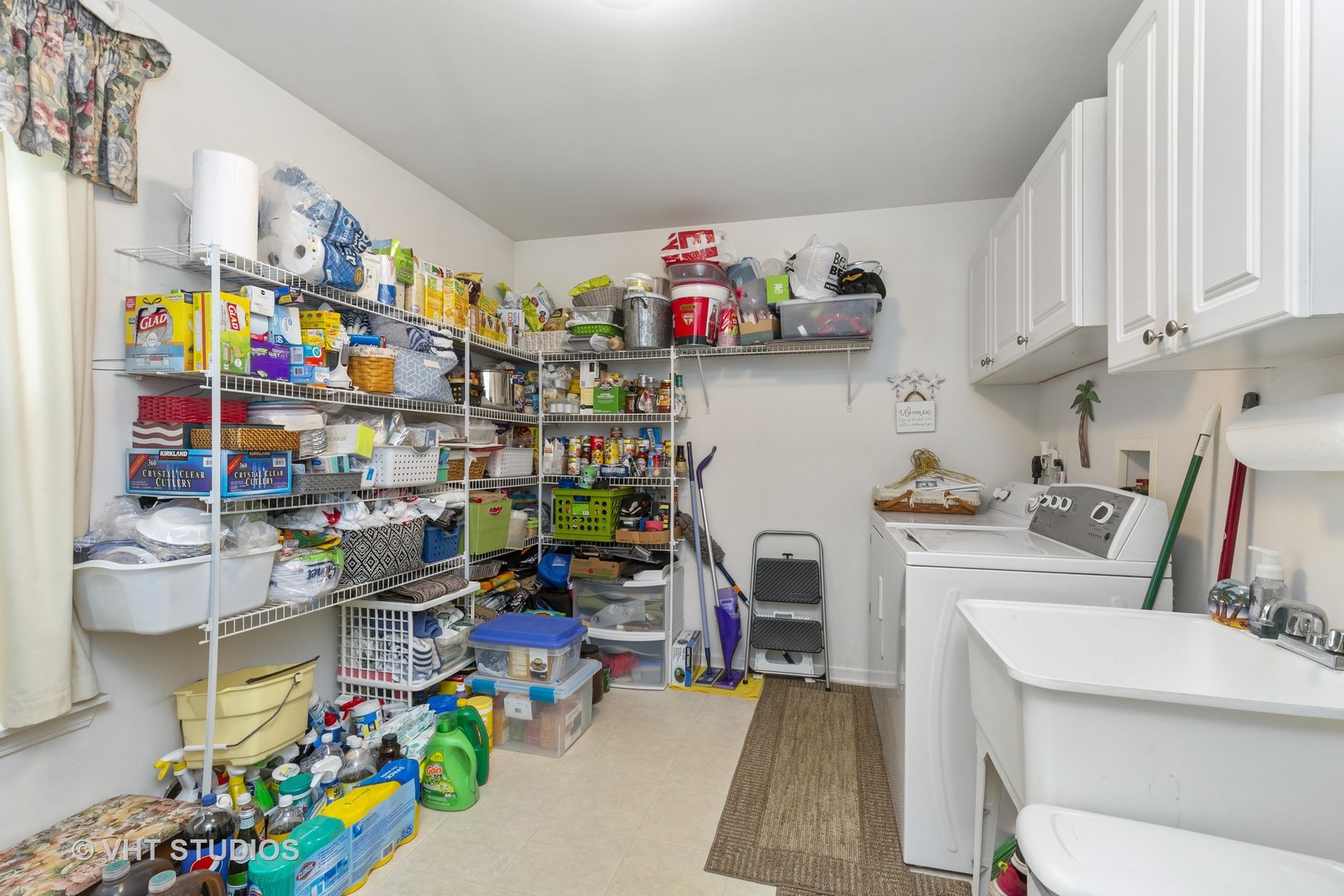 2621 Arbor Drive McHenry, IL 60050 - Photo 13 of 36 a utility room with lots of clutter and cabinets
