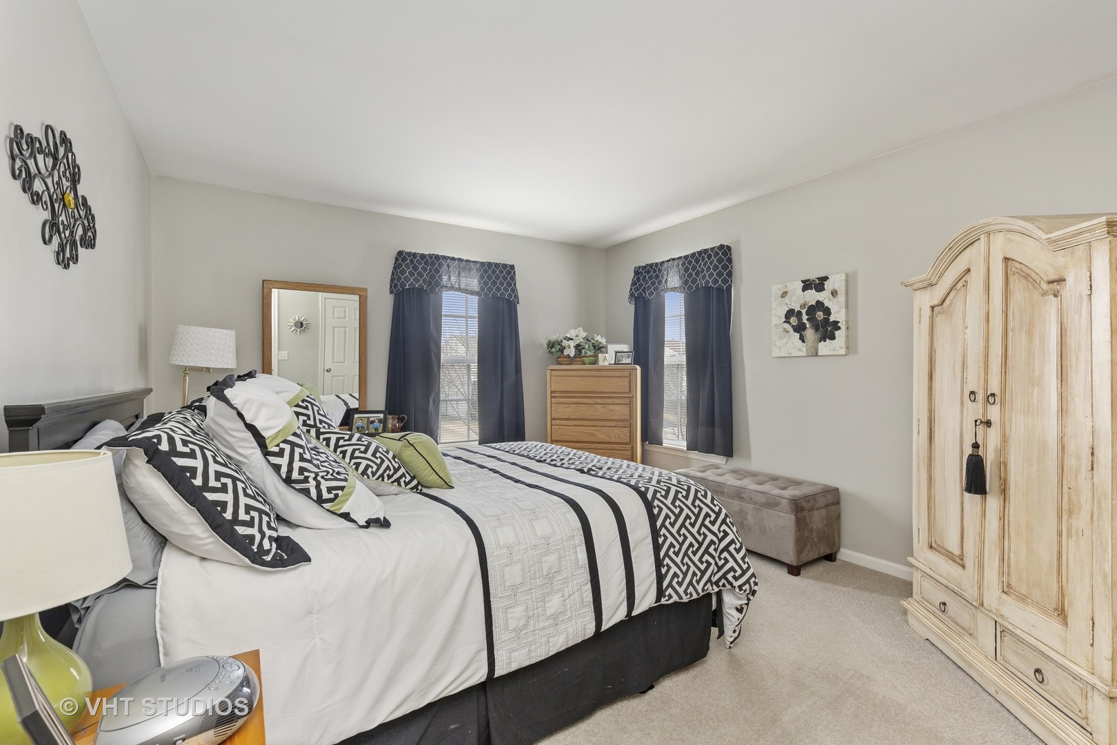 2621 Arbor Drive McHenry, IL 60050 - Photo 21 of 36 a bedroom with a bed and a large mirror