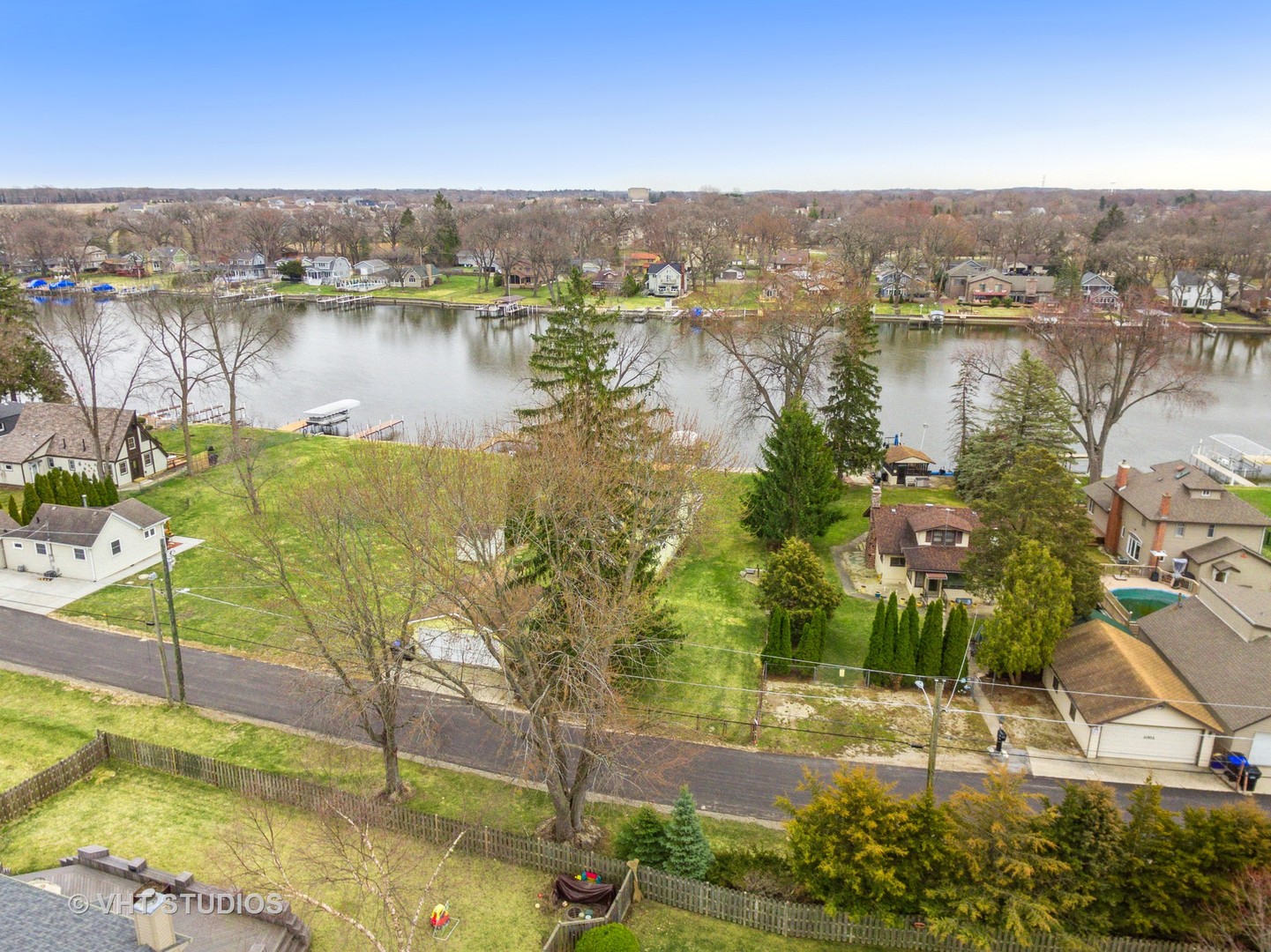 2621 Arbor Drive McHenry, IL 60050 - Photo 31 of 36 a view of a lake with a yard