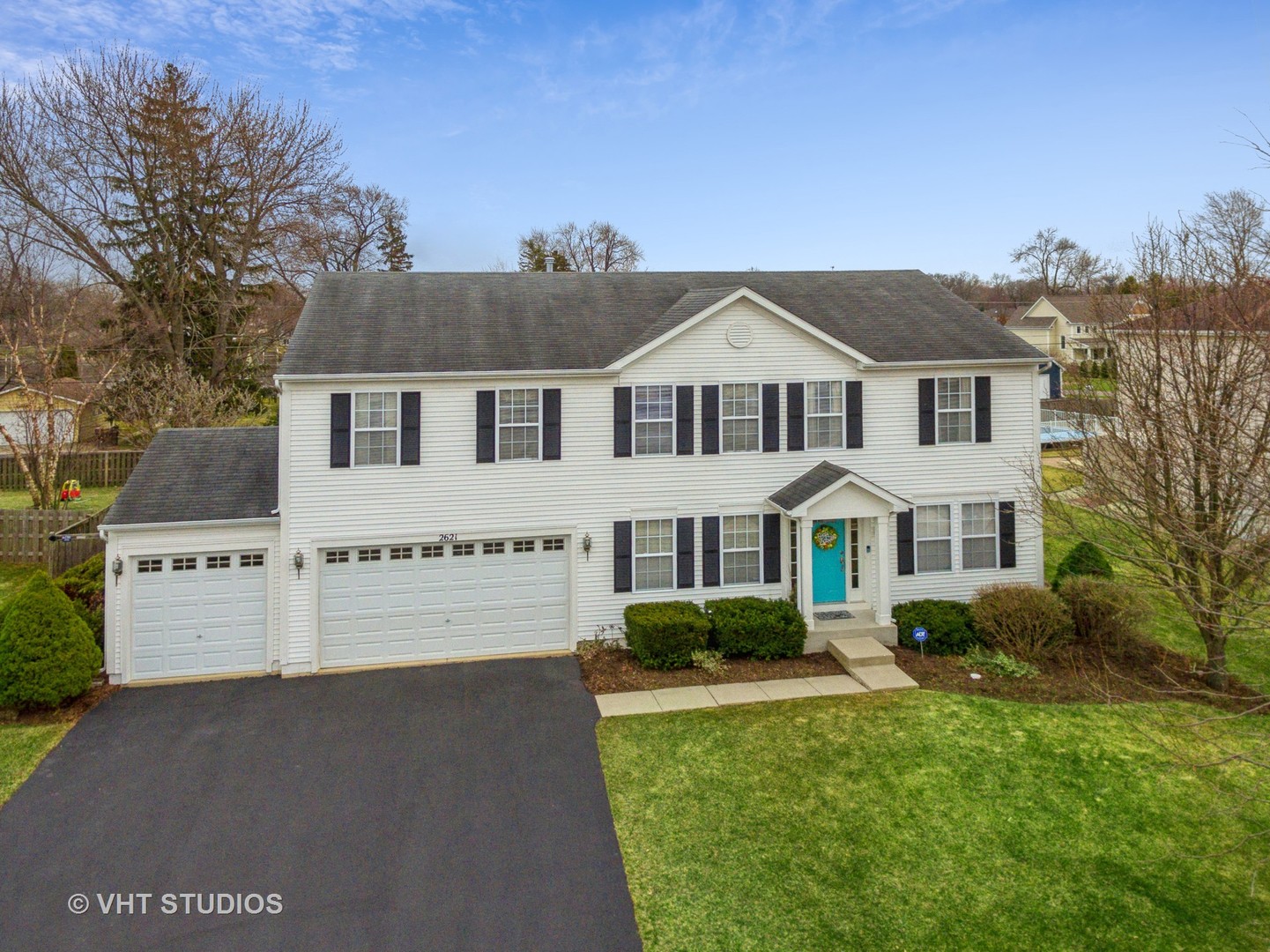 2621 Arbor Drive McHenry, IL 60050 - Photo 35 of 36 a front view of a house with a garden and plants