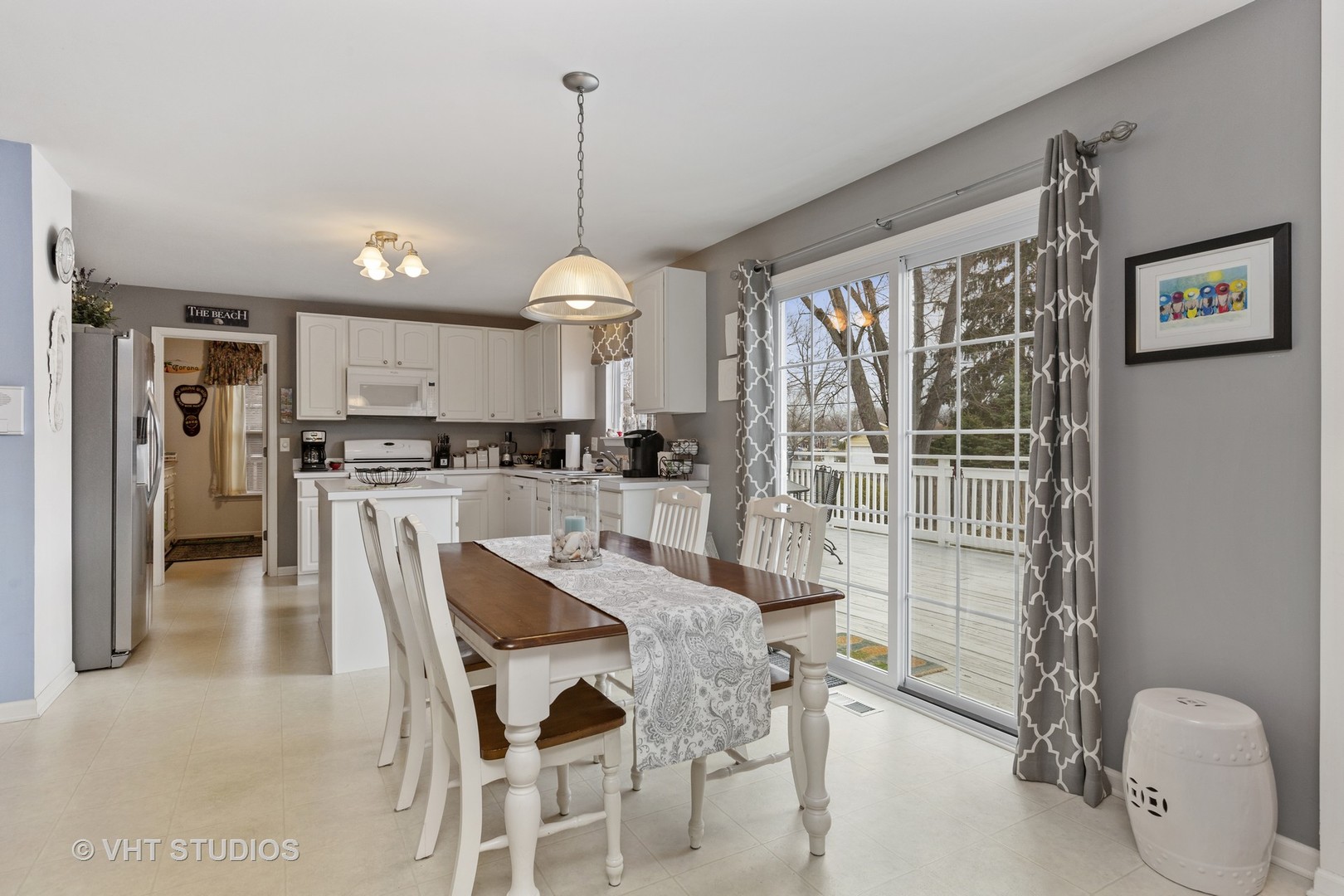 2621 Arbor Drive McHenry, IL 60050 - Photo 9 of 36 a kitchen with stainless steel appliances kitchen island granite countertop a refrigerator and microwave
