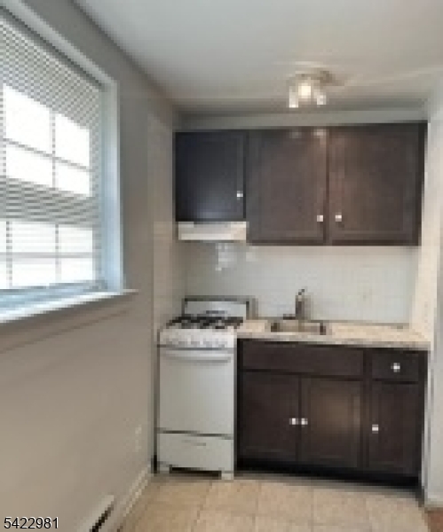 2116 Stanley Terrace, Unit 1 Union, NJ 07083 - Photo 5 of 7 a kitchen with a sink and cabinets