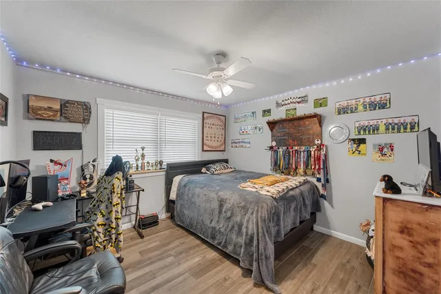 a bed room with furniture and a flat screen tv